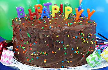 Image showing Chocolate cake with Happy Birthday candles.  Selective focus on 