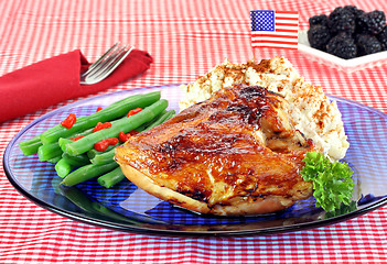 Image showing Barbecue chicken breast, string beans and potato salad garnished