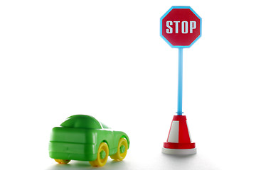 Image showing Car behind stop road sign
