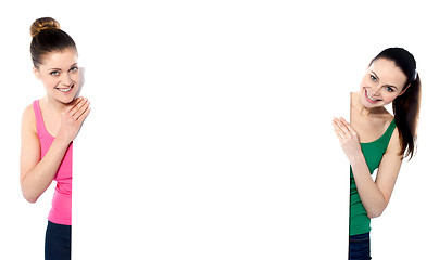 Image showing Beautiful women holding a blank whiteboard