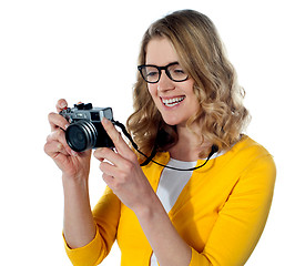Image showing Female photographer with a camera