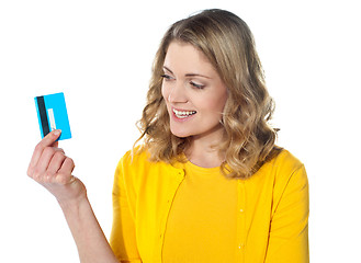 Image showing Attractive female holding her credit card