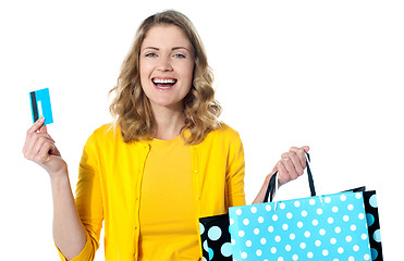 Image showing Happy shopaholic female laughing