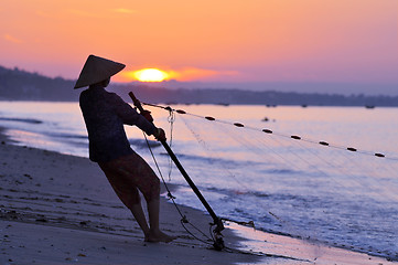 Image showing Silhouette of a fisherman