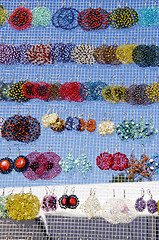 Image showing many colorful handmade earrings sale market fair 