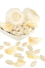 Image showing Garlic and herbal supplement pills isolated, alternative medicine concept