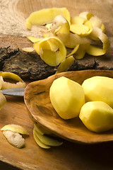 Image showing Raw potatoes and potato peels