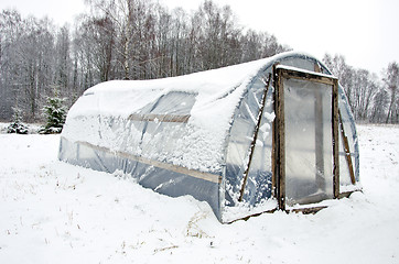 Image showing wooden diy homemade greenhouse polythene snow 