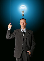 Image showing business man turn on the light