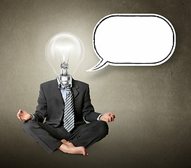Image showing businessman in lotus pose and lamp-head with thought bubble