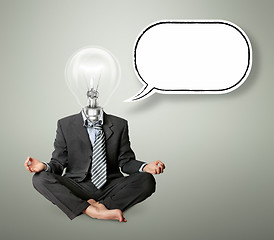 Image showing businessman in lotus pose and lamp-head with thought bubble