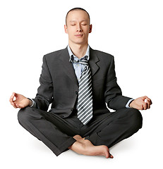 Image showing businessman in lotus pose meditating
