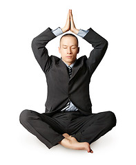 Image showing businessman in lotus pose meditating