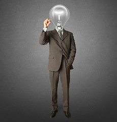 Image showing businessman with lamp-head and marker