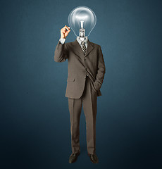 Image showing businessman with lamp-head and marker
