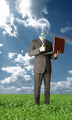 Image showing businessman with lamp-head outdoors