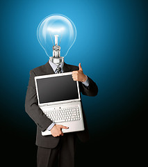 Image showing businessman with lamp-head with open laptop shows welldone