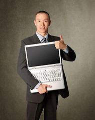 Image showing businessman with open laptop shows welldone