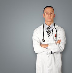 Image showing doctor in glasses smiles at camera