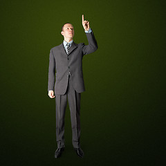 Image showing full length businessman push the button