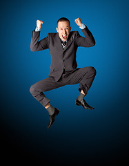 Image showing Happy businessman jumping