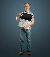 Image showing man with open laptop in his hands