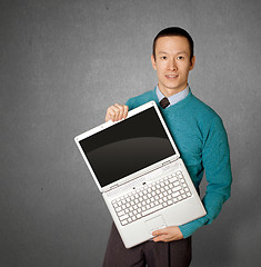 Image showing Male in blue with laptop