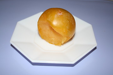 Image showing Yellow plum on small plate