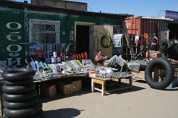 Image showing Lazy seller at market