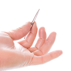 Image showing hand in rubber glove holding tweezers