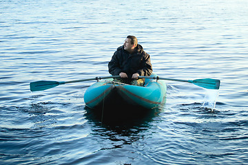 Image showing Fisherman in Rubber Boat