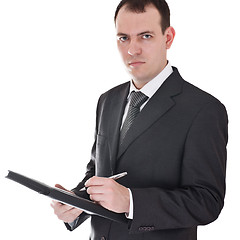 Image showing businessman with pen and notepad