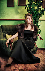 Image showing Beautiful Lady Sitting in Armchair