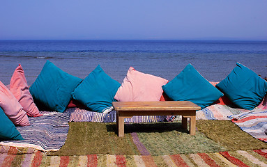 Image showing Blanket and table on beach