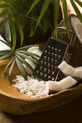 Image showing Grated coconut with grater and nut 