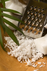 Image showing Grated coconut with grater and nut 