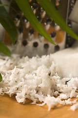 Image showing Grated coconut with grater and nut 