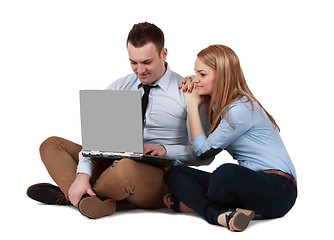 Image showing Young couple working on a laptop