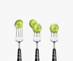 Image showing Tomato pierced by fork,  isolated on white background 