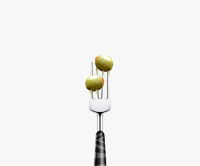 Image showing olive pierced by fork,  isolated on white background 