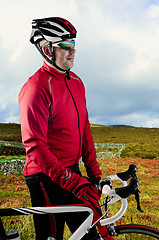 Image showing Cyclist and his bike