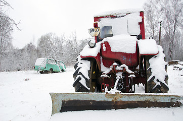 Image showing old russian soviet tractor covered snow in winter 