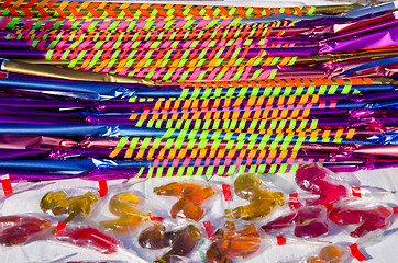Image showing Long and delicious candies with colorful papers 