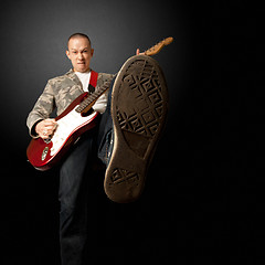 Image showing rocker with guitar and foot