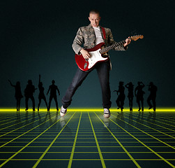 Image showing punk man with the guitar and silhouette