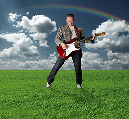 Image showing hippie girl with the guitar outdoor