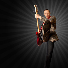 Image showing rocker with guitar and foot