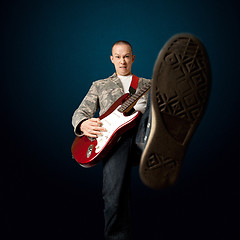 Image showing rocker with guitar and foot