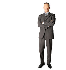 Image showing smiling standing businessman in suit 