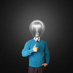 Image showing young businessman with lamp-head